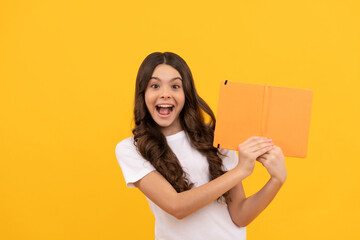 amazed school teen girl ready to study with copybook, education