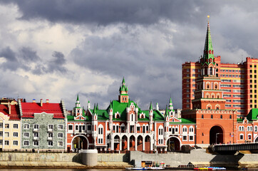 Spasskaya Tower and the wedding palace building in front of the theatre bridge. Russia Yoshkar Ola 01.05.2021. High quality photo