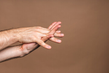 Fototapeta premium Hand wash. Man hands using wash hand sanitizer gel pump dispenser for protection coronavirus and bacteria, health care concept. Close-up.