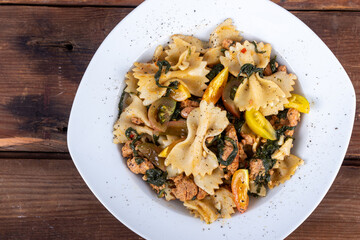Pasta farfales dish with italian sausage