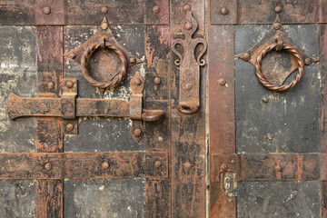 fragments of handles and bolts on the medieval gate