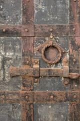 fragments of handles and bolts on the medieval gate