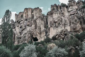 Huge stones and behind trees in ihlara valley