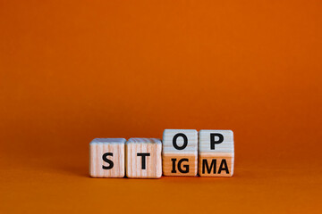 Stop stigma symbol. Turned wooden cubes with words stop stigma. Beautiful orange background....