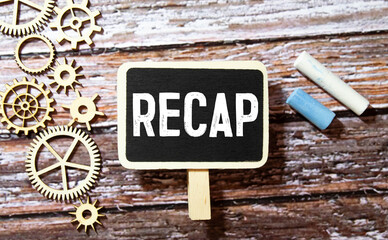 Recap symbol. The word 'recap' on wooden cubes on beautiful grey background, copy space.