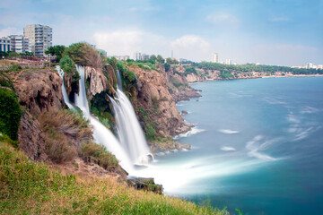 Obraz premium Waterfall Duden at Antalya, Turkey. Duden Falls and sea cliffs. River Duden in Antalya. nature travel background