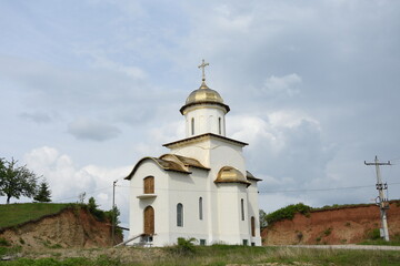 Fototapeta na wymiar Church with gilded roof in BRASOV area, Romania, 2017