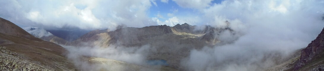 Panoramic photo. The Caucasus is Russia. View of the Teberda mountain range from an altitude of 3035 meters