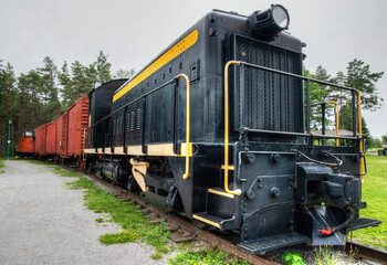 Fototapeta na wymiar old diesel locomotive carriages and caboose