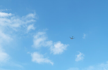 Fototapeta na wymiar Small plane flying in the clouds.