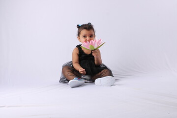 Cute Little Indian Girl holding a lotus flower