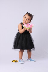 Cute Little Indian Girl holding a lotus flower