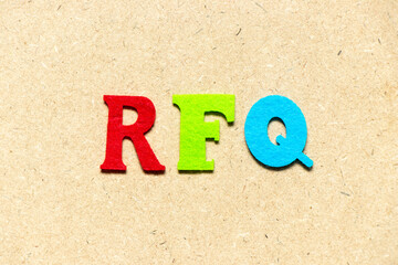 Color cloth alphabet letter in word RFQ (abbreviation of request for quotation) on wood background