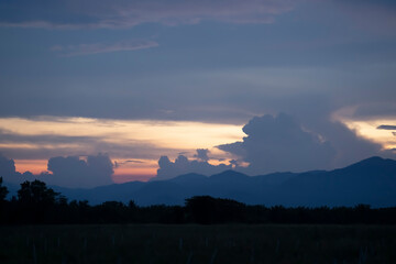Senset moment view behind the mountain in the golden light from the sun.