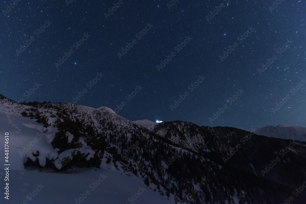 Wall mural bright starry sky with the milky way on the background of high tatras mountains
