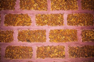  Brown laterite stone wall.