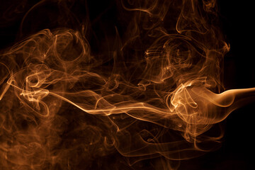 Movement gold smoke on black background.