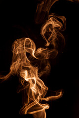 Movement gold smoke on black background.