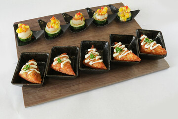 Christmas bites salad and prawn paste bread canapés in small plate in white background Christmas festival menu