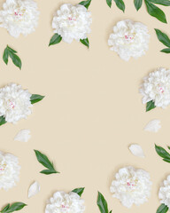 Frame with white peony flowers and green leaves on light beige. Summer flat lay, love, romance concept.
