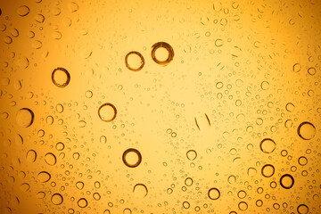 Yellow water droplets background.