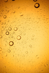 Yellow water droplets background.