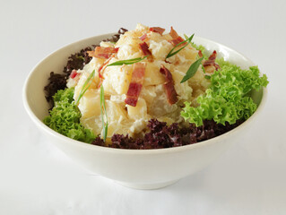 potato salad with bacon and tartar sauce in white background Christmas festival menu