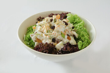 season green vegetables, potato and fruit apple coleslaw with salad dressing sauce appetiser in white background Christmas festival menu