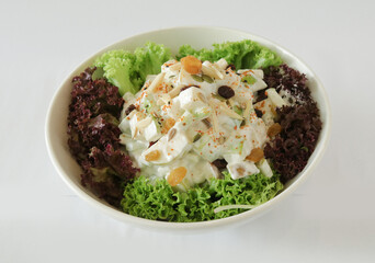 season green vegetables, potato and fruit apple coleslaw with salad dressing sauce appetiser in white background Christmas festival menu