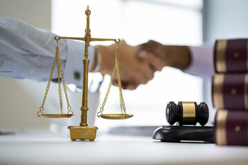 Client Lawyer Handshake In Courtroom