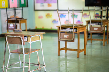 Back to school concept. School empty classroom, Lecture room with desks and chairs iron wood for studying lessons thailand without young student.School closed due to covid 2019