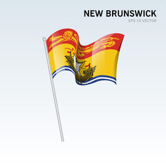 Waving flag of New Brunswick provinces of Canada isolated on gray background