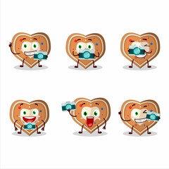 Photographer profession emoticon with gingerbread heart cartoon character