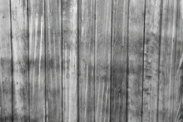 Aged wood background with diagonal line of nails.