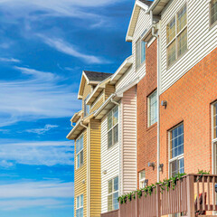 Square Townhouses with balconies that looks out to scenic views of the neighborhood