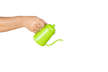 hand holding a green kettle