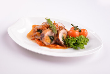 grilled chicken meat wrapped with pumpkin and vegetables roll with tomato sauces in white background for Christmas festival menu