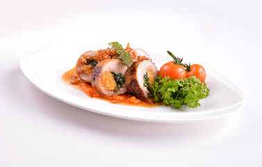 grilled chicken meat wrapped with pumpkin and vegetables roll with tomato sauces in white background for Christmas festival menu