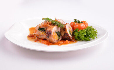grilled chicken meat wrapped with pumpkin and vegetables roll with tomato sauces in white background for Christmas festival menu