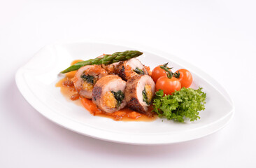 grilled chicken meat wrapped with pumpkin and vegetables roll with tomato sauces in white background for Christmas festival menu