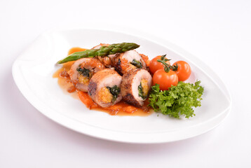 grilled chicken meat wrapped with pumpkin and vegetables roll with tomato sauces in white background for Christmas festival menu