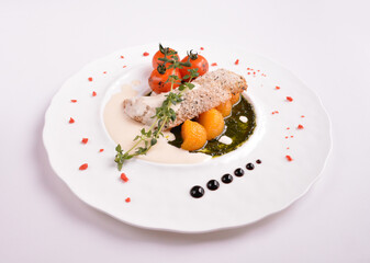 deep fried bake bread fish fillet seafood with orange and tomato in chef rosemary sauce and vegetables in white background for Christmas festival menu