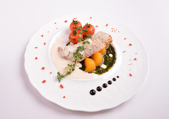 deep fried bake bread fish fillet seafood with orange and tomato in chef rosemary sauce and vegetables in white background for Christmas festival menu