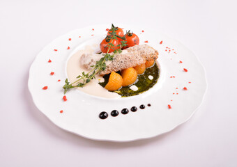 deep fried bake bread fish fillet seafood with orange and tomato in chef rosemary sauce and vegetables in white background for Christmas festival menu