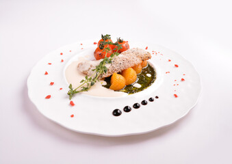 deep fried bake bread fish fillet seafood with orange and tomato in chef rosemary sauce and vegetables in white background for Christmas festival menu