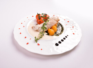 deep fried bake bread fish fillet seafood with orange and tomato in chef rosemary sauce and vegetables in white background for Christmas festival menu