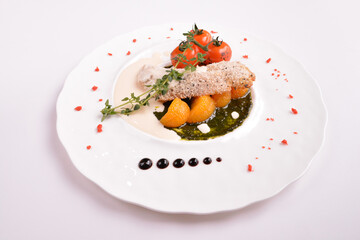 deep fried bake bread fish fillet seafood with orange and tomato in chef rosemary sauce and vegetables in white background for Christmas festival menu