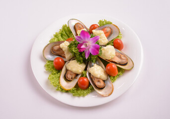 bbq baked cheese muscle on shell seafood with vegetable salad in white background for Christmas festival menu