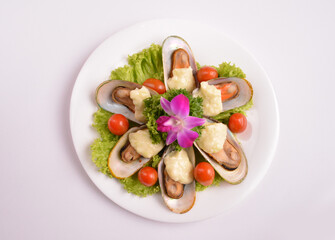 bbq baked cheese muscle on shell seafood with vegetable salad in white background for Christmas festival menu