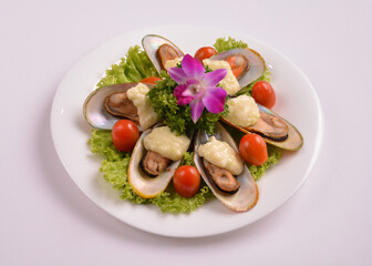 bbq baked cheese muscle on shell seafood with vegetable salad in white background for Christmas festival menu